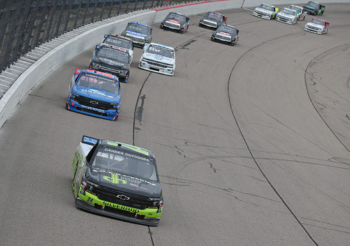NEWTON, IOWA - JUNE 16: Brett Moffitt, driver of the #24 Destiny Homes Smart Series Chevrolet, leads a pack of trucks during the NASCAR Gander Outdoor Truck Series M&amp;M's 200 Presented by Casey's General Store at Iowa Speedway on June 16, 2019 in Newton, Iowa. (Photo by Matt Sullivan/Getty Images)