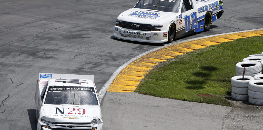 DAYTONA BEACH, FLORIDA - AUGUST 16: Natalie Decker, driver of the #44 N29 Capital Partners LLC Chevrolet, leads Tate Fogleman, driver of the #02 Solid Rock Carriers Chevrolet, during the NASCAR Gander RV &amp; Outdoors Truck Series Sunoco 159 at Daytona International Speedway on August 16, 2020 in Daytona Beach, Florida. (Photo by Brian Lawdermilk/Getty Images)